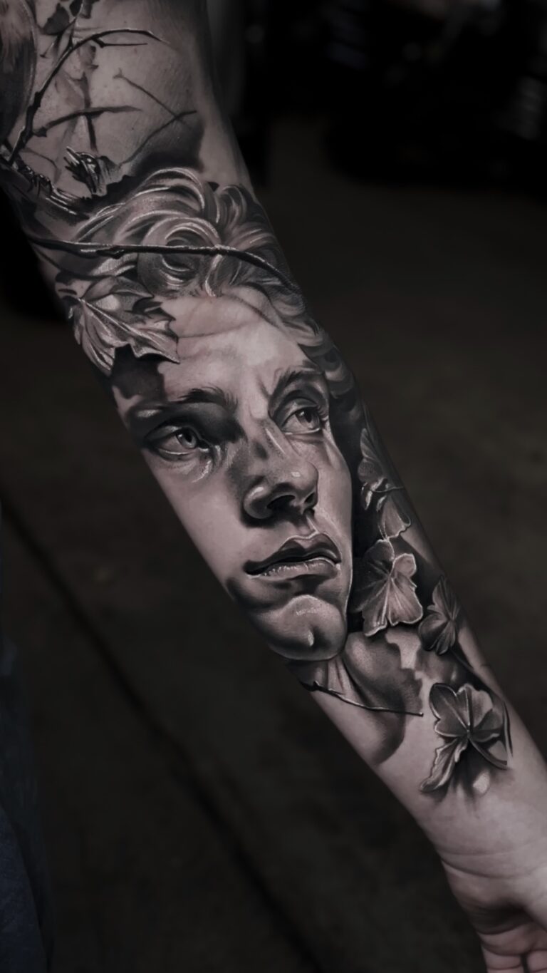 Black and grey realism tattoo by Bryn Holman featuring detailed contrast, inspired by mythology, film, and philosophy.
