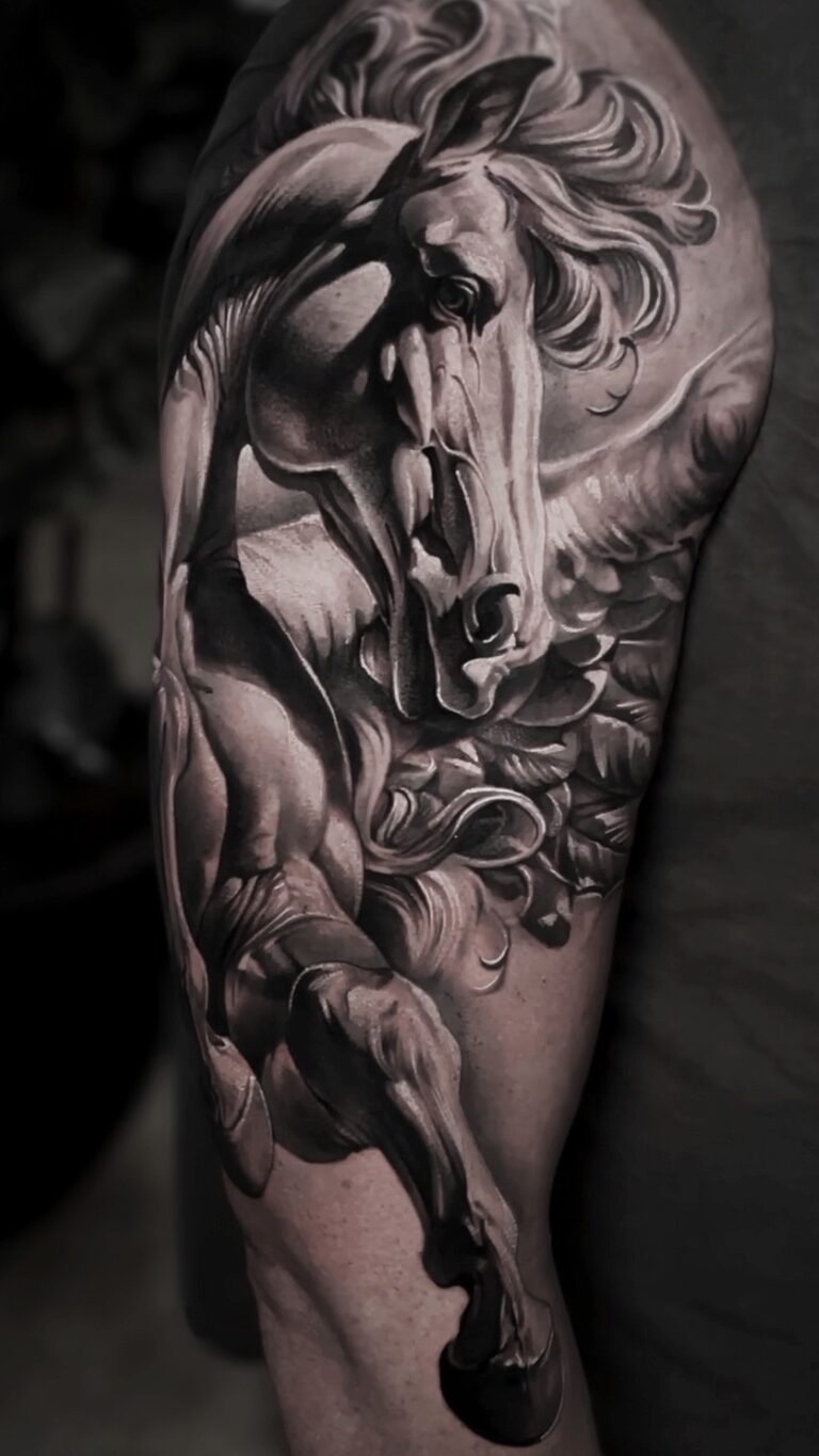 Black and grey realism tattoo by Bryn Holman featuring detailed contrast, inspired by mythology, film, and philosophy.