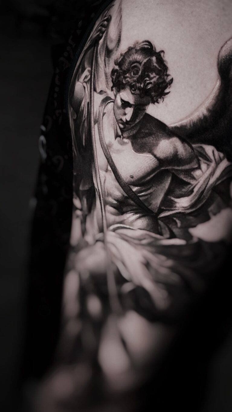 Black and grey realism tattoo showcasing detailed shading and themes from philosophy and mythology.